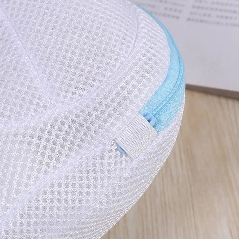 a white mesh mesh bag with blue trim