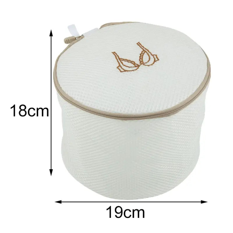 the white round storage bag with gold embroidery