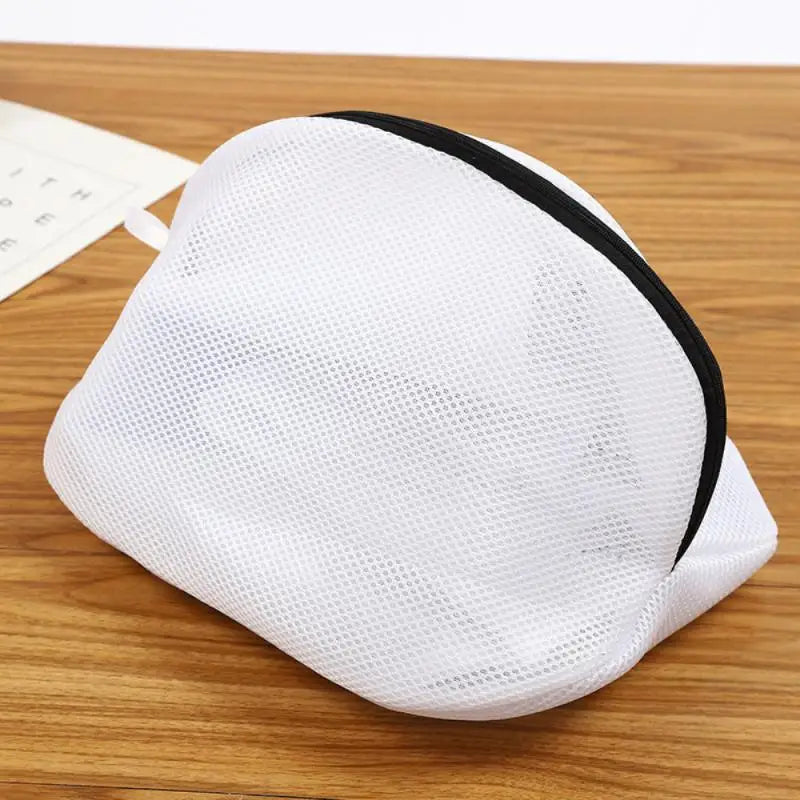 a white mesh bag on a wooden table