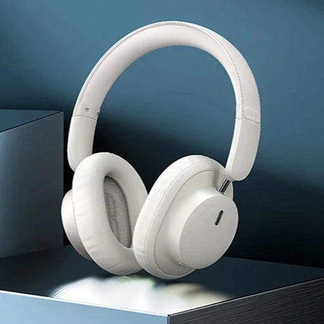 White over-ear wireless headphones with a sleek, minimalist design.