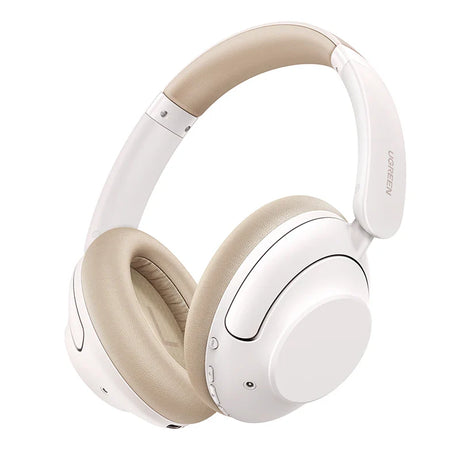 White over-ear wireless headphones with beige cushions and headband.