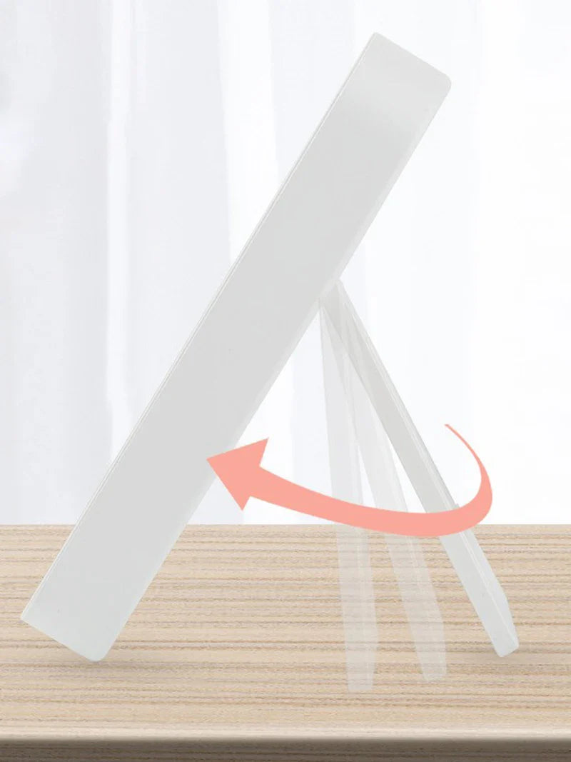 a white paper holder with a pink arrow on top