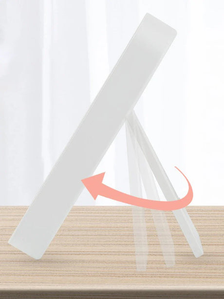 a white paper holder with a pink arrow on top