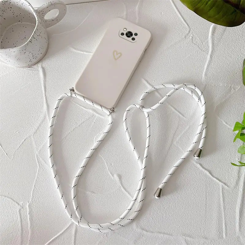 a white phone with a white string on it