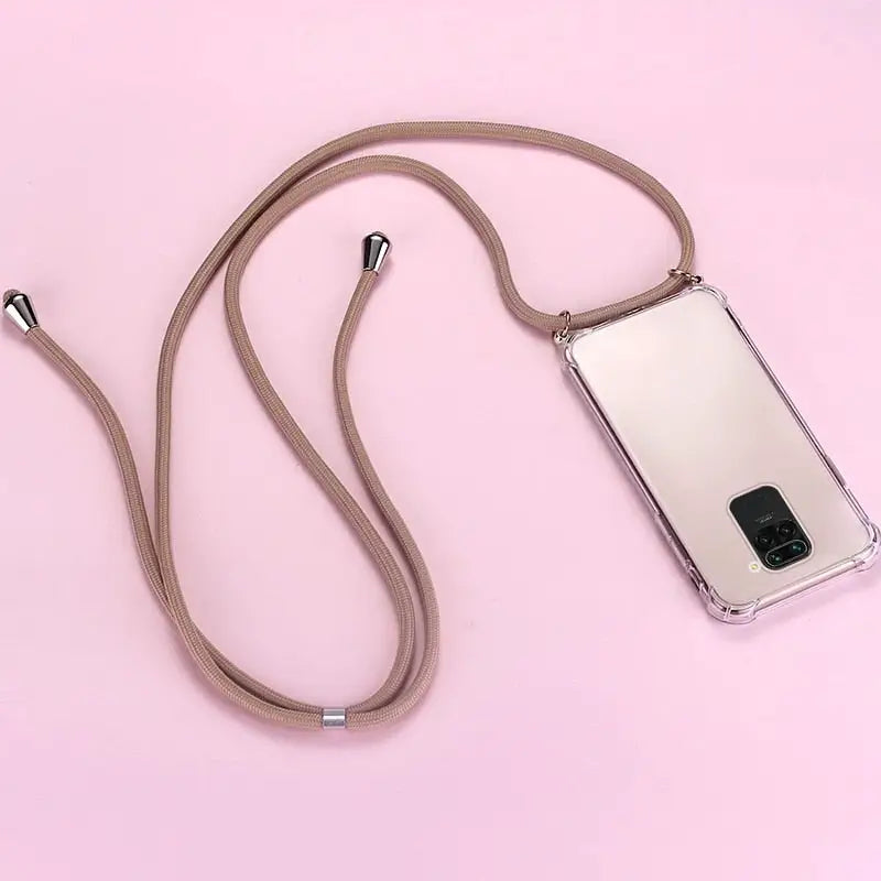 a white cell phone with a brown cord