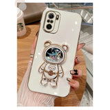a white phone case with a bear and a flower