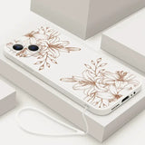 A white phone case with brown flowers on it