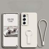 A white phone case with a built-in kickstand and a matching wrist strap.