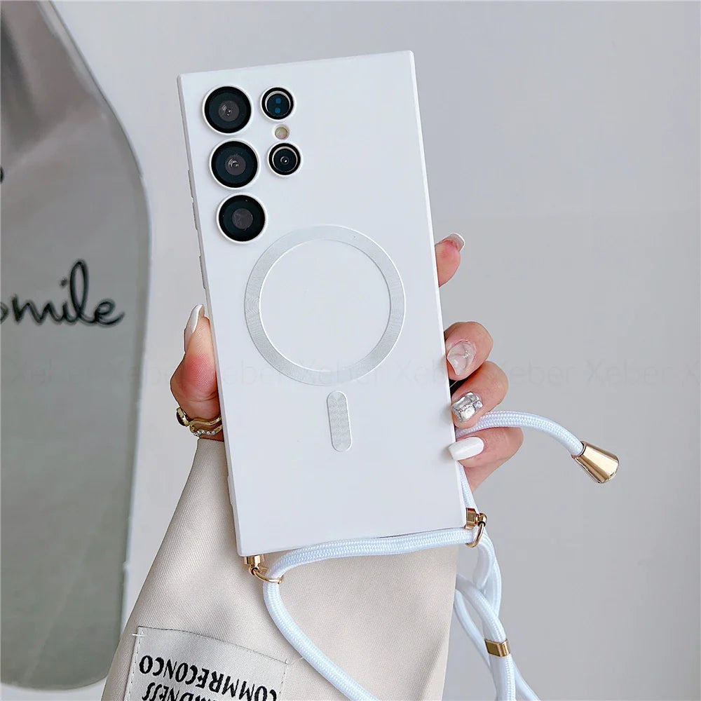 White phone case with camera cutouts, a circular magnetic charger, and an attached lanyard.