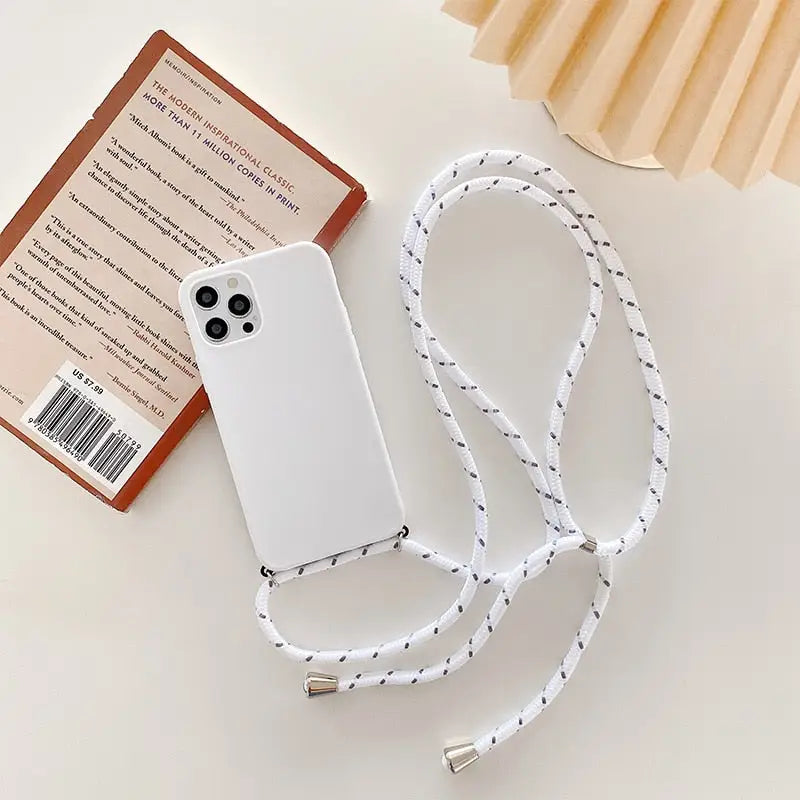 there is a white phone case with a white string attached to it