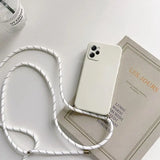 a white phone case with a white cord