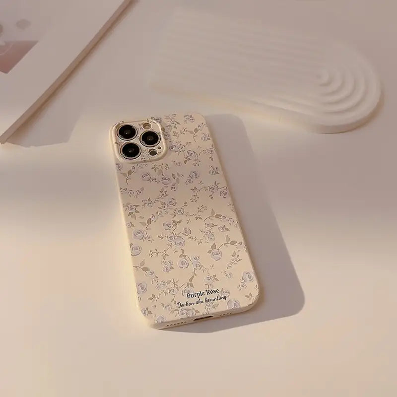 a white phone case with a flower pattern