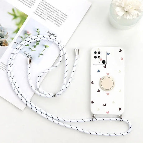 there is a cell phone case with a strap and a flower