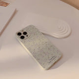 a white phone case with a flower pattern