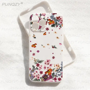 A white phone case with flowers and butterflies