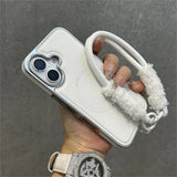White phone case with fluffy strap.