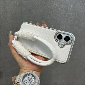 White phone case with fluffy strap.