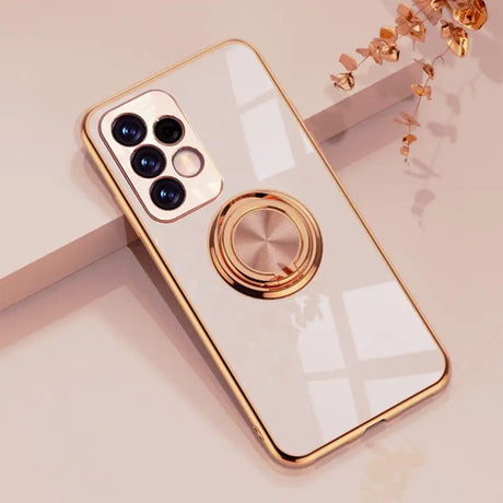 a white phone with a gold ring on it