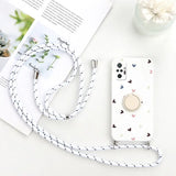 a white phone case with a heart pattern on it