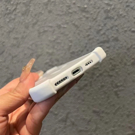 White phone case with port cutouts.