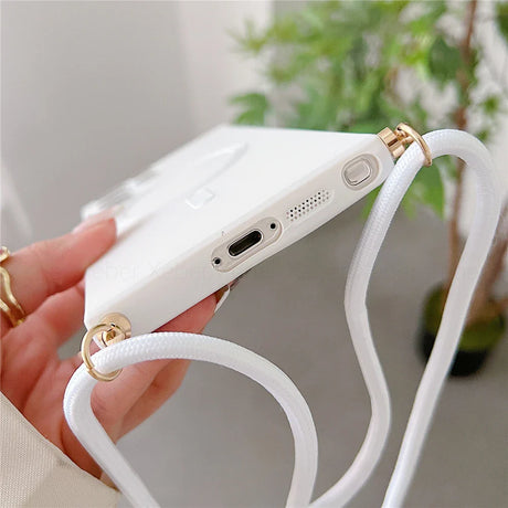 White phone case with a shoulder strap.