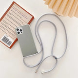 a white phone case with a silver cable