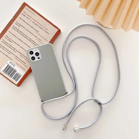 a white phone case with a silver cable