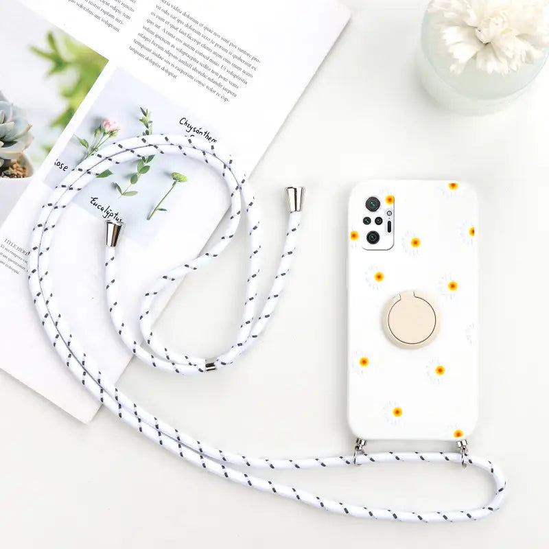 a white phone case with a yellow flower on it