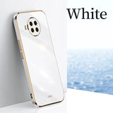 a white phone with a gold frame and a white background