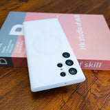 a white phone with a red and gray box