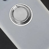 a white phone with a metal ring on the back