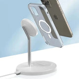 A white phone stand with a charging cable