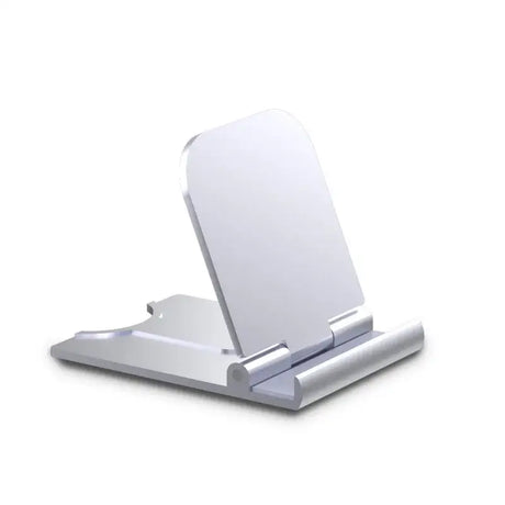 There is a white phone stand with a mirror on it