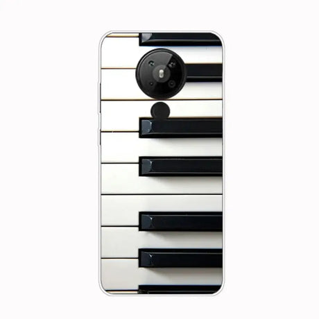 a white piano keyboard with black keys on it