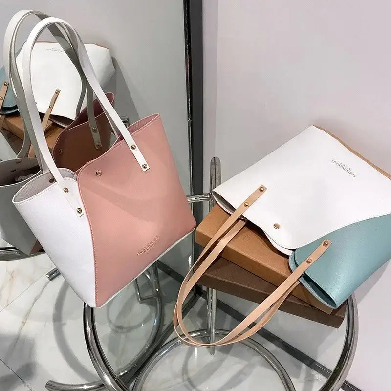a white and pink bag on a stand