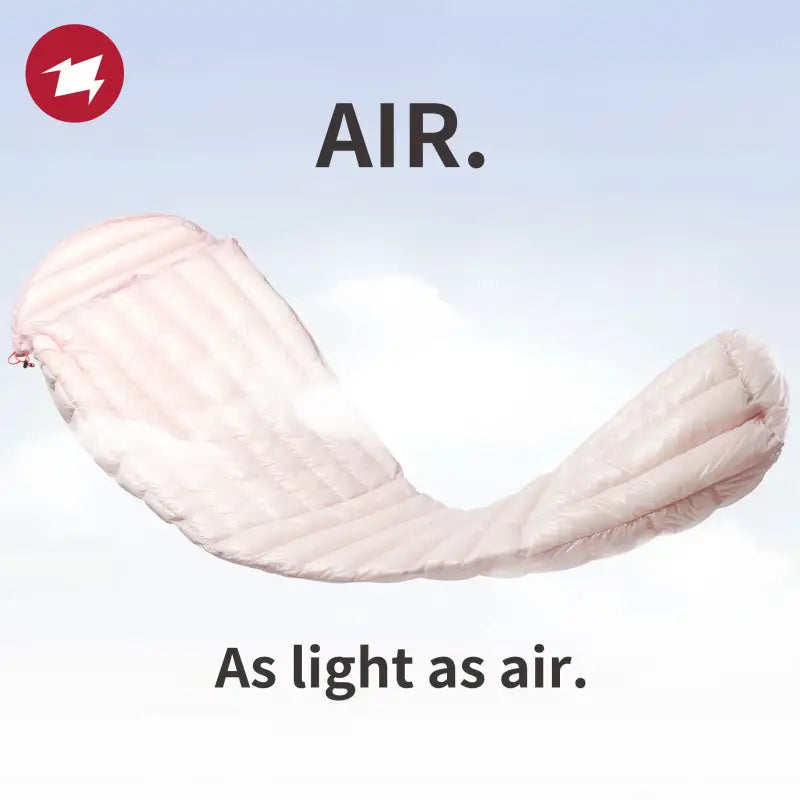 a white and pink blanket flying in the air