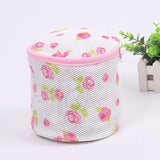 a white and pink flower pattern storage box