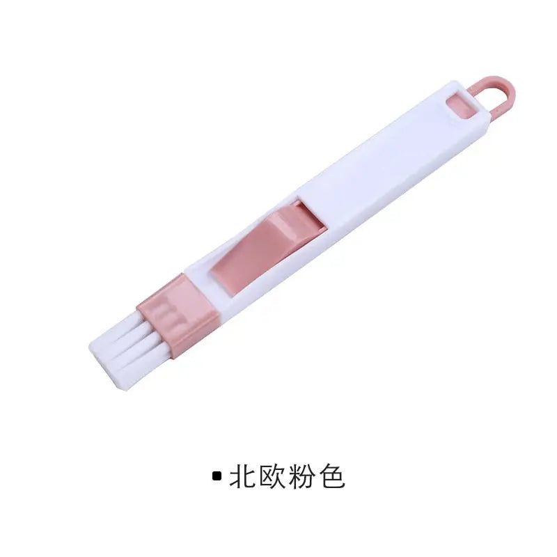 a white and pink plastic handle with a pink handle