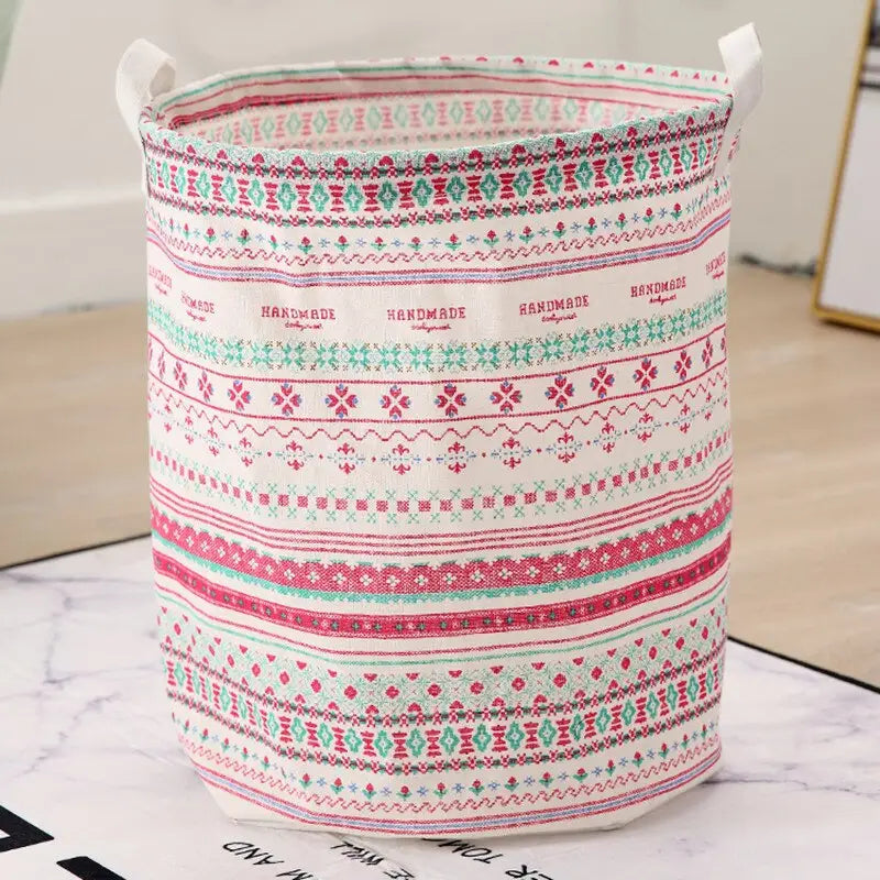 a white and pink patterned fabric storage bag