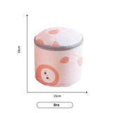 a white and pink polka dot pattern storage box