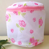 a white bag with pink roses on it