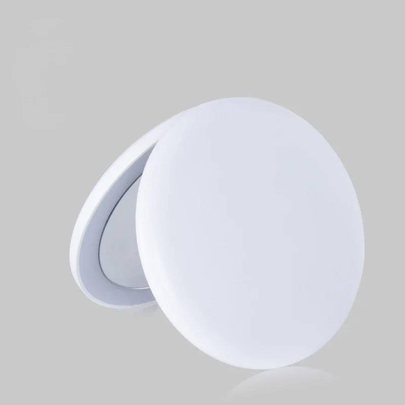 a white plastic knob with a round shape