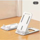 White plastic smartdevil phone holder with gray accents and minimalist design for home or office use