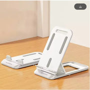 White plastic smartdevil phone holder with gray accents and minimalist design for home or office use