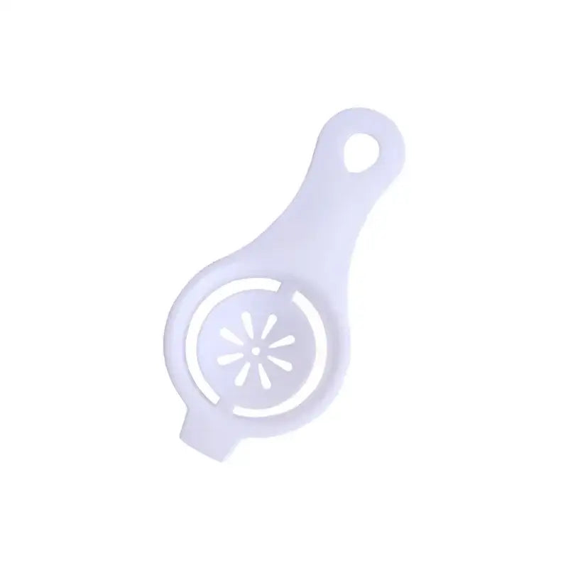 there is a white plastic spoon with a flower on it