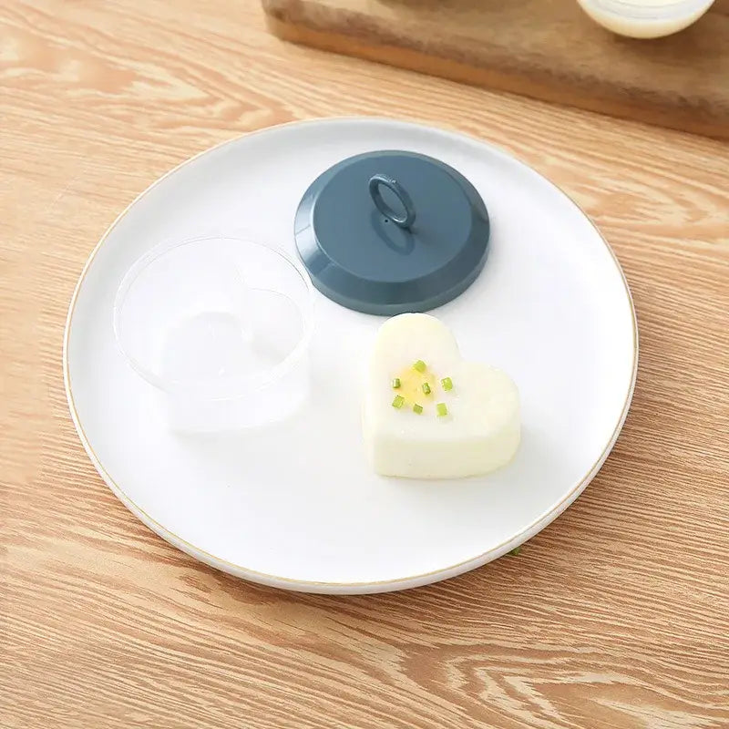 a white plate with a blue lid and a small piece of butter