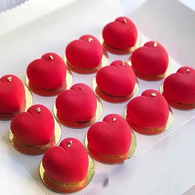 a white plate topped with red macaroes