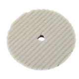 a white pad with a hole in the middle