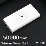 a white power bank sitting on top of a black leather couch