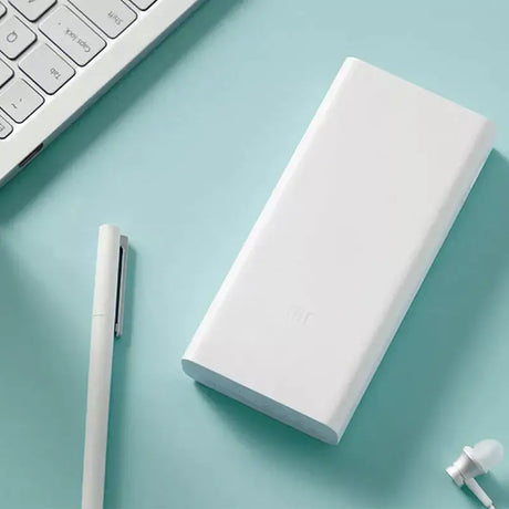 A white power bank sitting on top of a desk